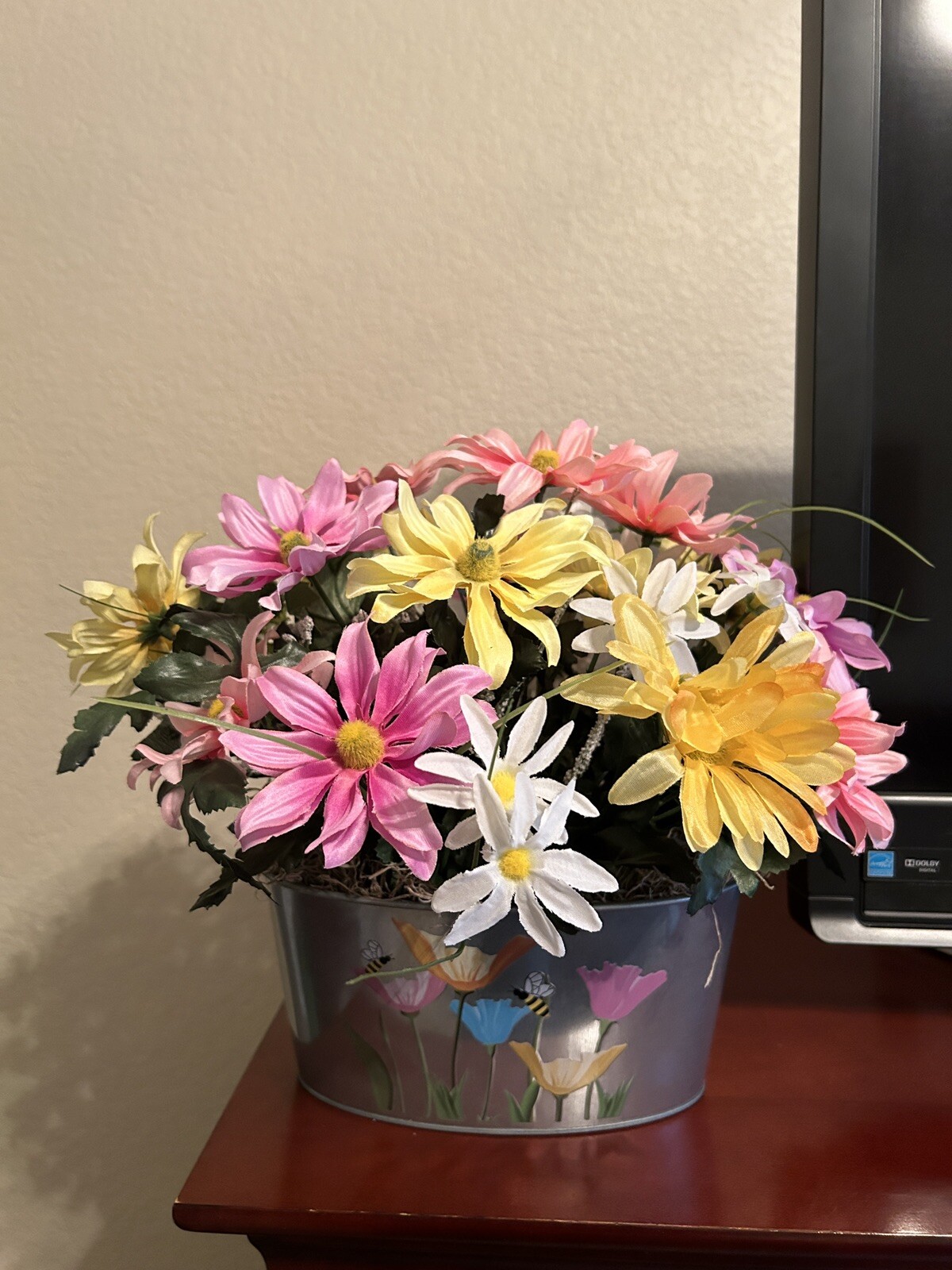 Spring Flower Arrangement in a Silver Metal Canister with Flower and Bee Motif