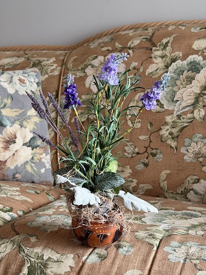 Decor Artificial bouquet purple flowers in a round decorative painted pumpkin