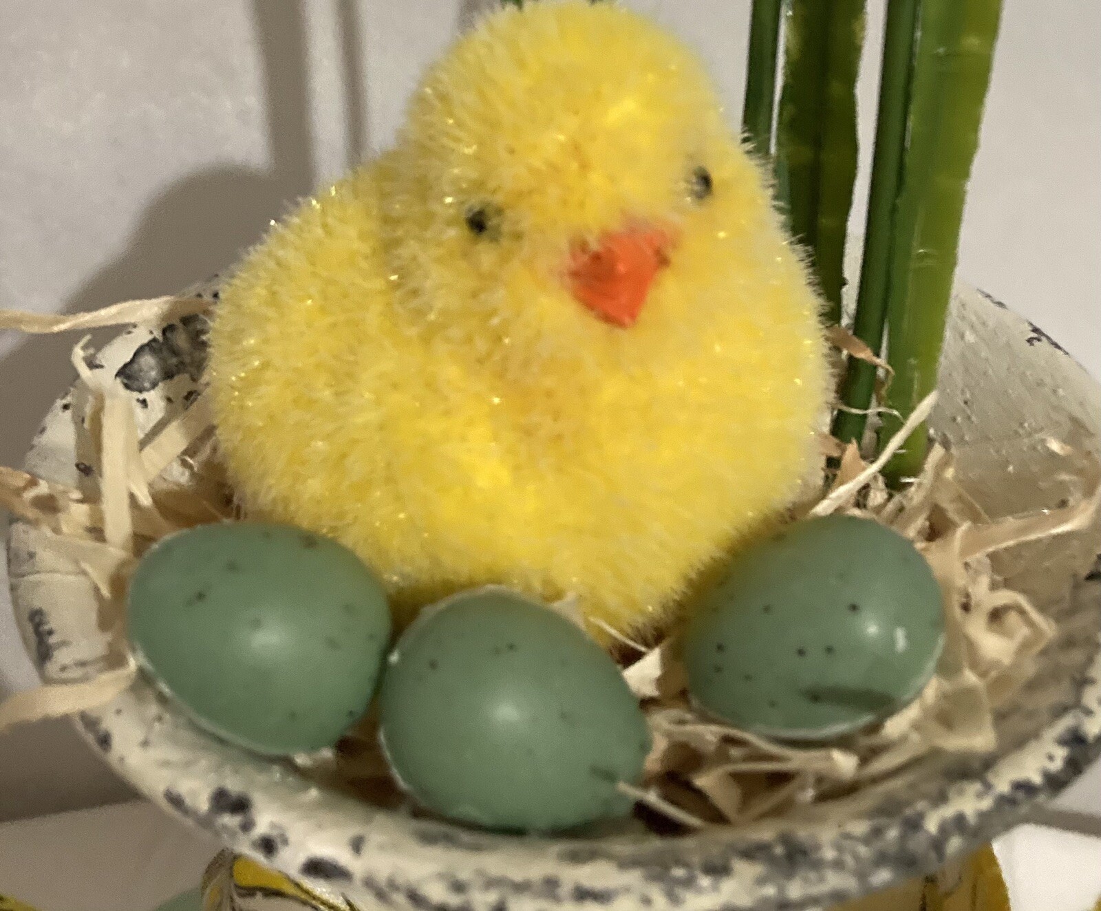 Cute Little Yellow Chick With Eggs In An Urn