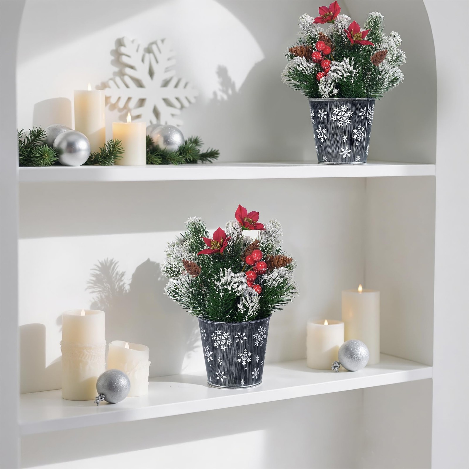 Potted Snowy Norfolk Pine Branches with Poinsettias Barries and Pin Cones