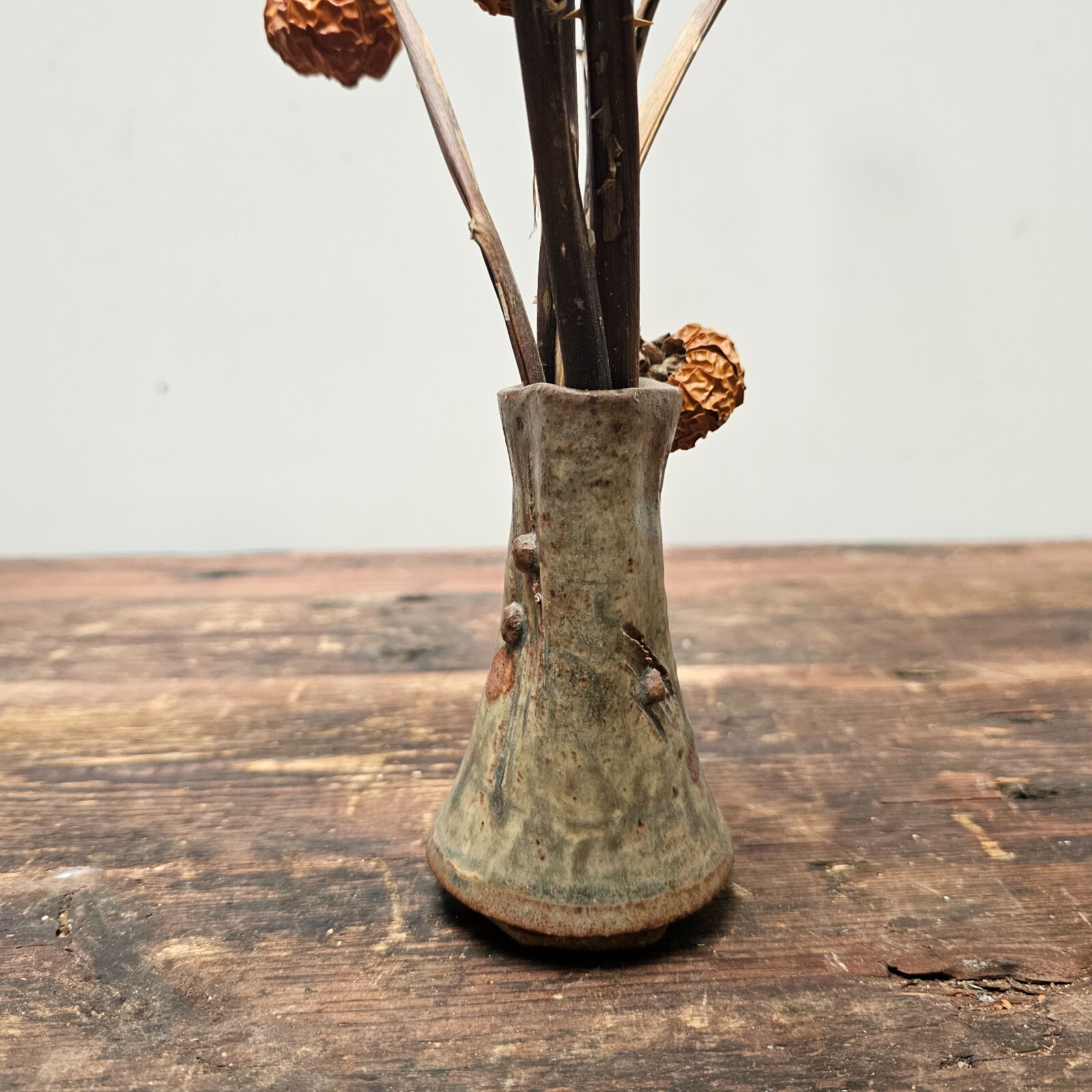 Dried Pumpkins On Sticks In A Singed Vase Asian Style Decoration