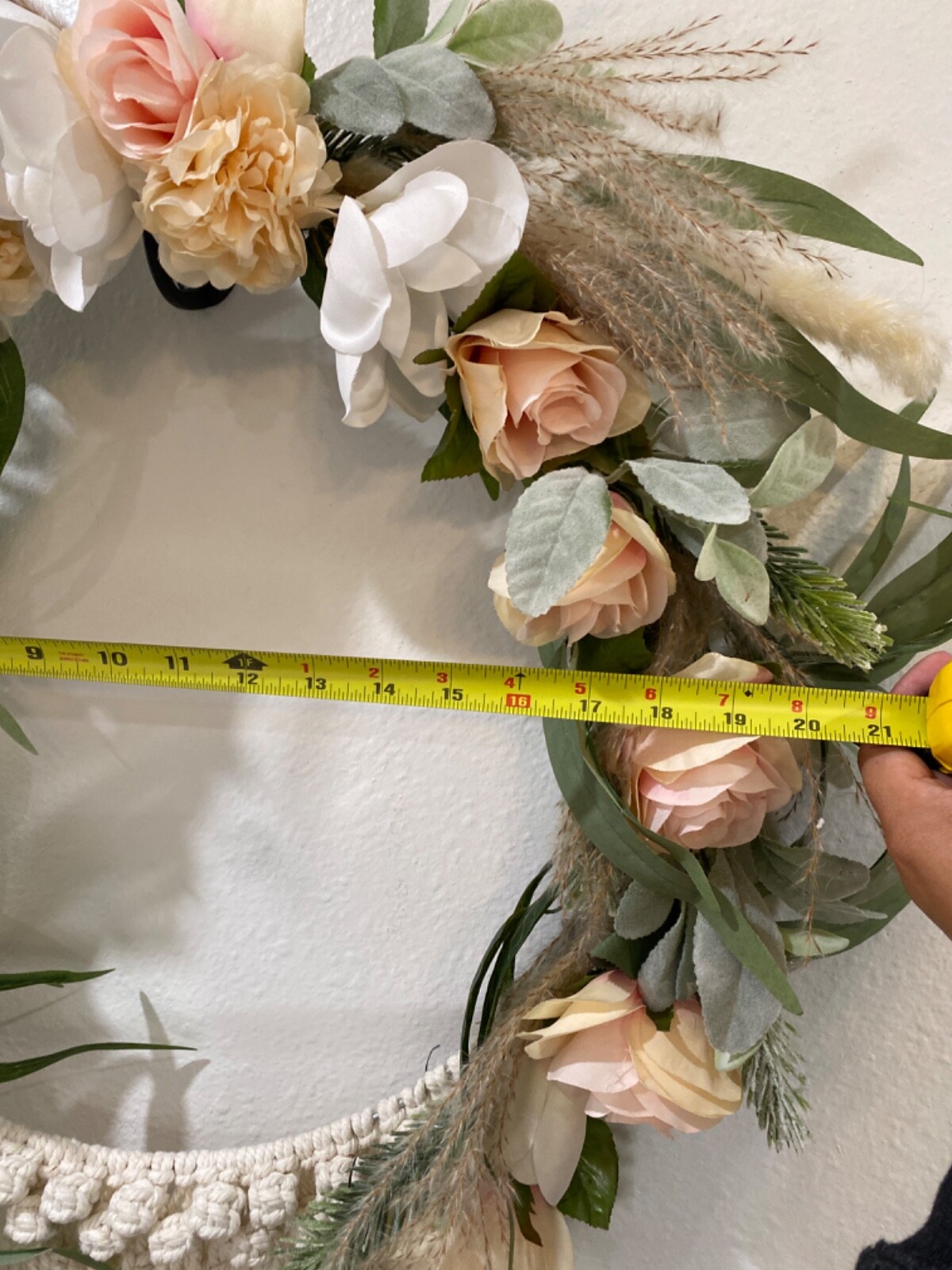 Macramé Boho pastel colored flowered wreath. Measures 58 inches in length
