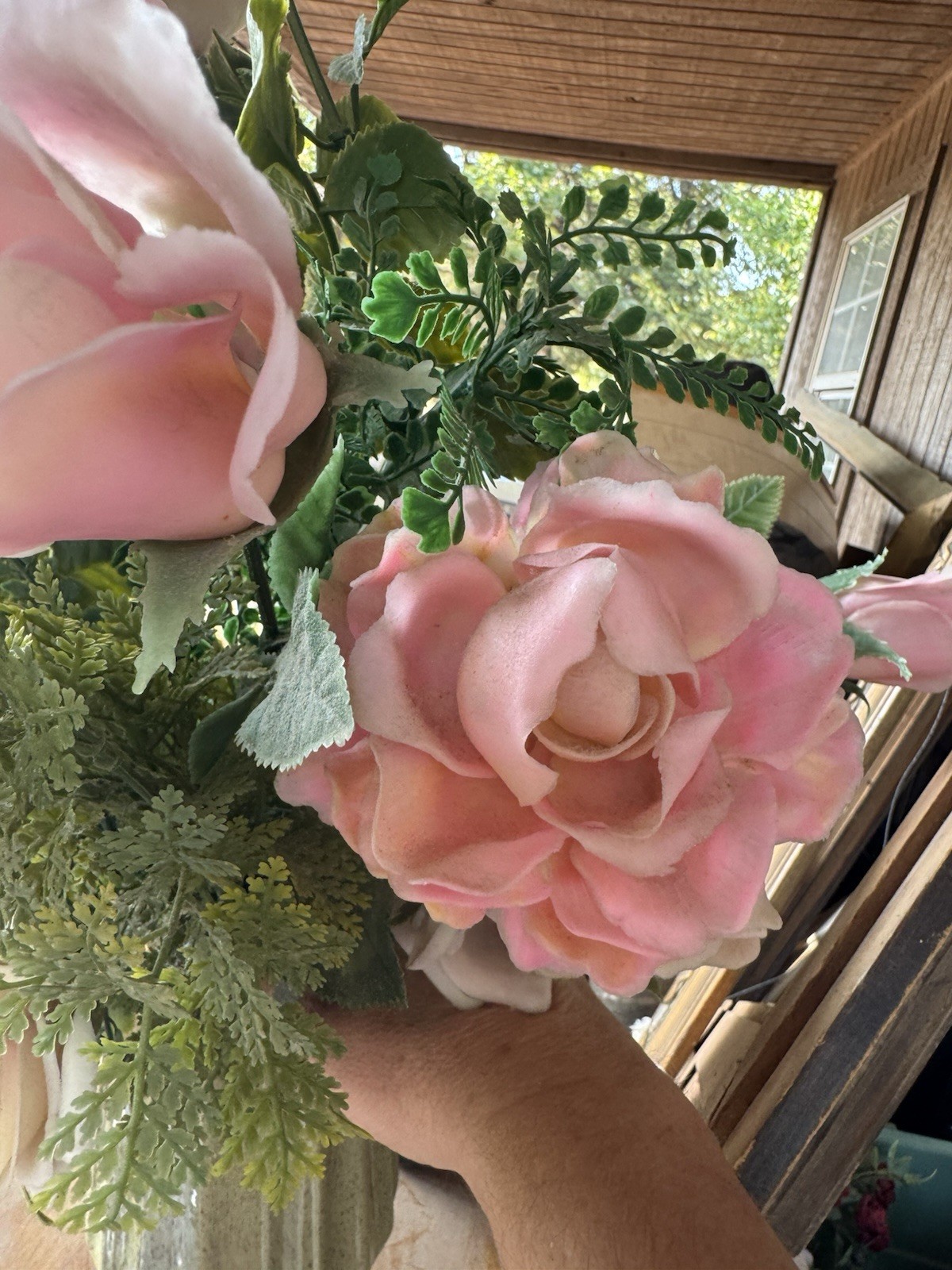 Faux Rose Flower Arrangement In Pottery Vase