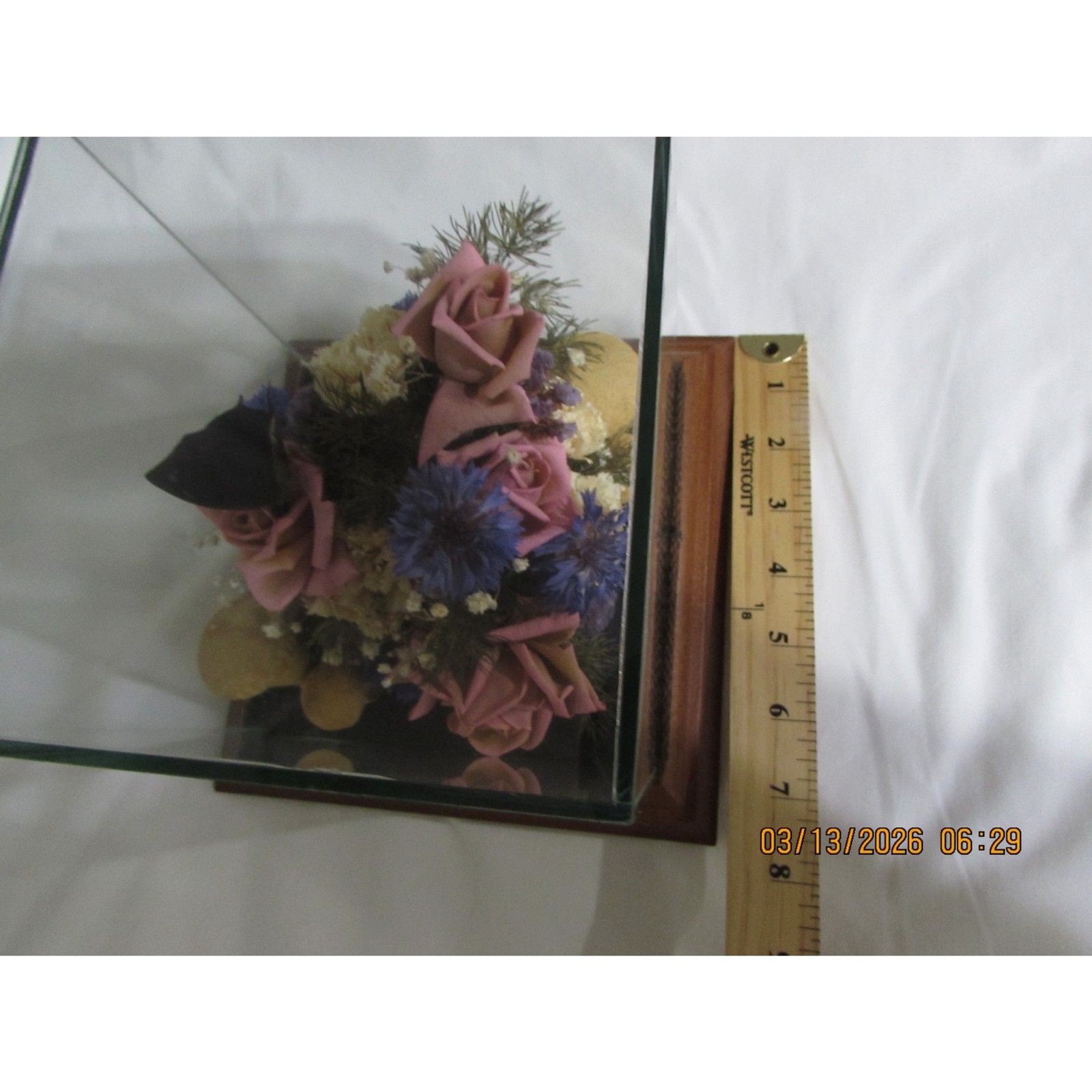 Vintage dried flower arrangement in glass with wood base butterfly mushrooms