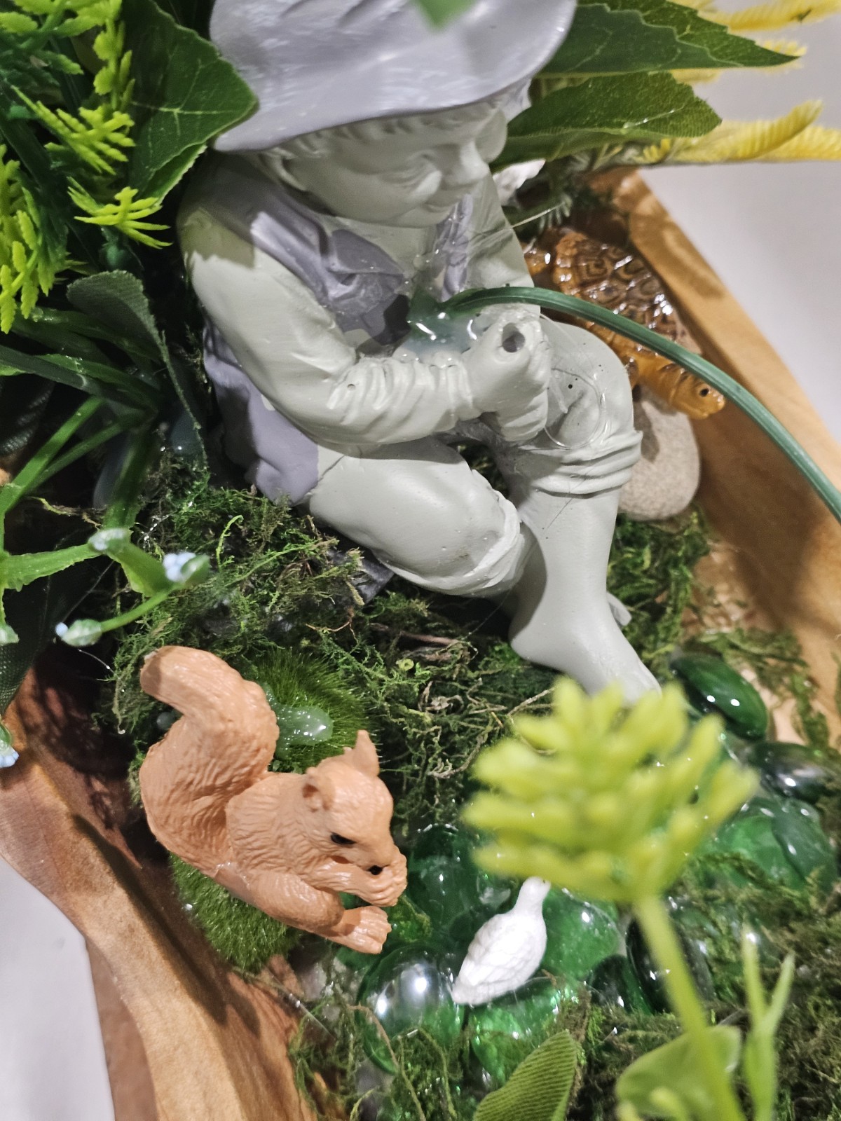 Artifical Flower Arramgement in woods, Boy Fishing Deer, Turtle Duck