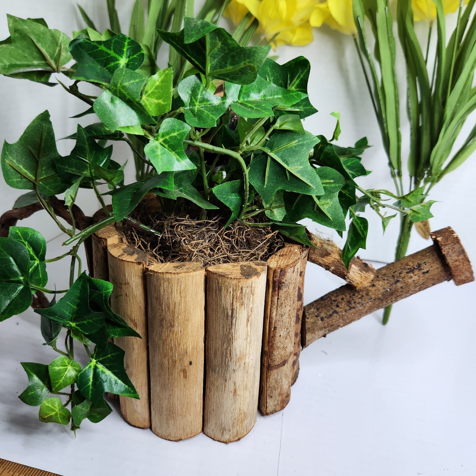 Vintage World Bazaar Faux Daffodil Flowers Rustic Log Watering Can Planter Decor