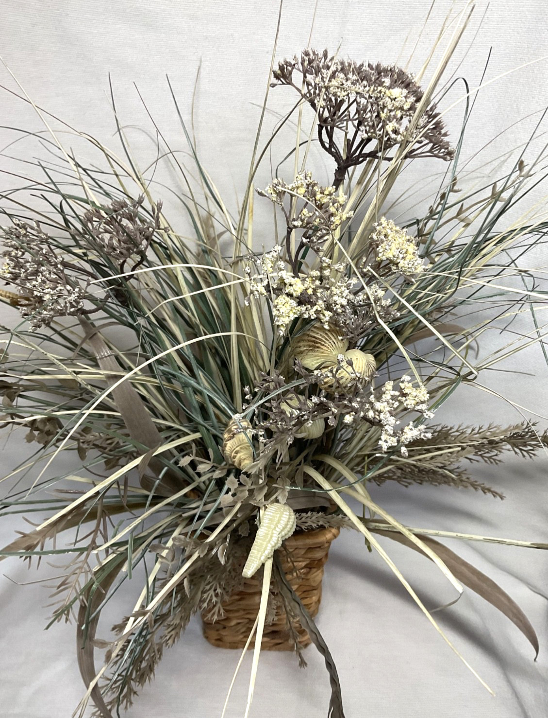 3333333M3ed3333ium Size 33333Woven Basket of Dried Foliage and Shells. 19″ Tall.