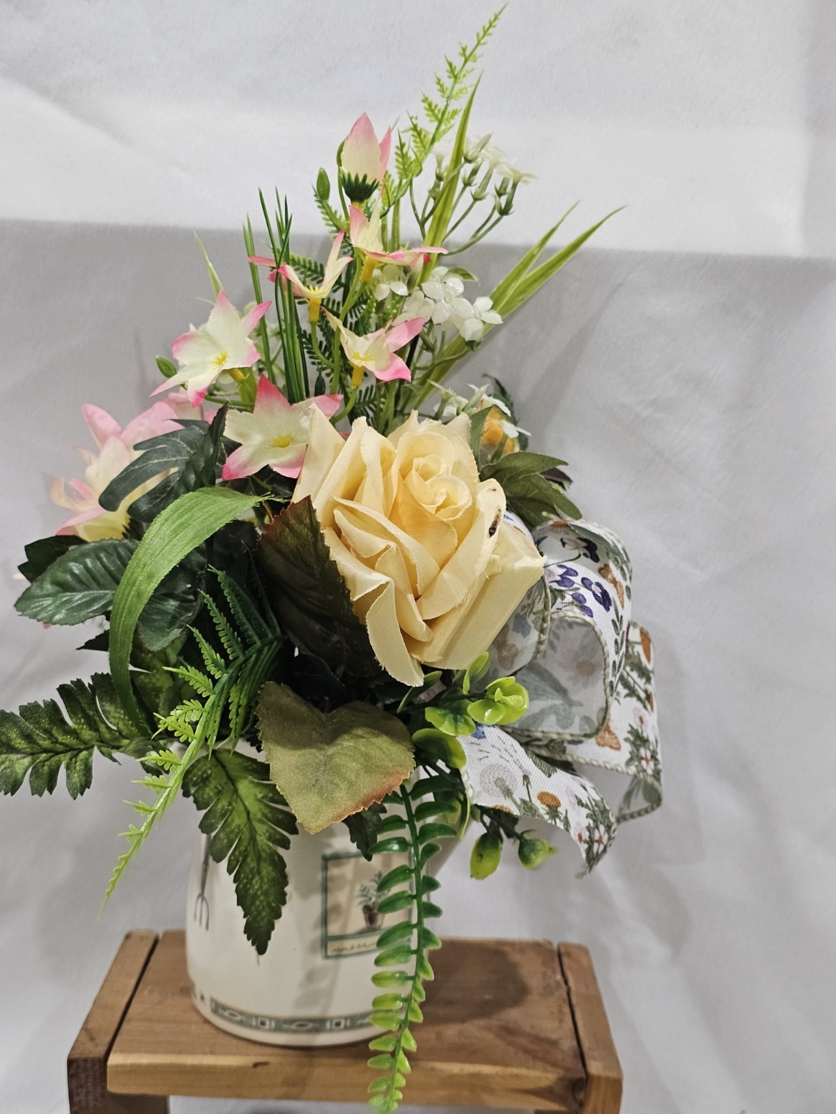 Artificial Flower Arrangement Soft Yellow Roses in a Homey Green & White vase