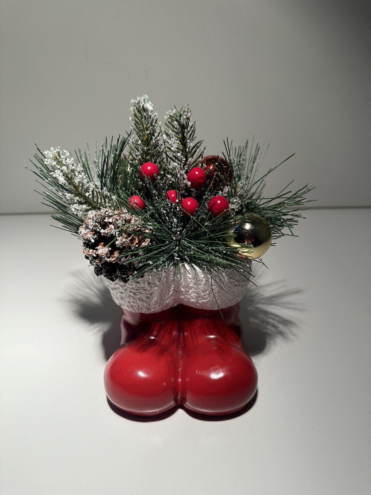 Vintage Concrete Pine Christmas Arrangement in A Pair Of Red Santa Clause Boots