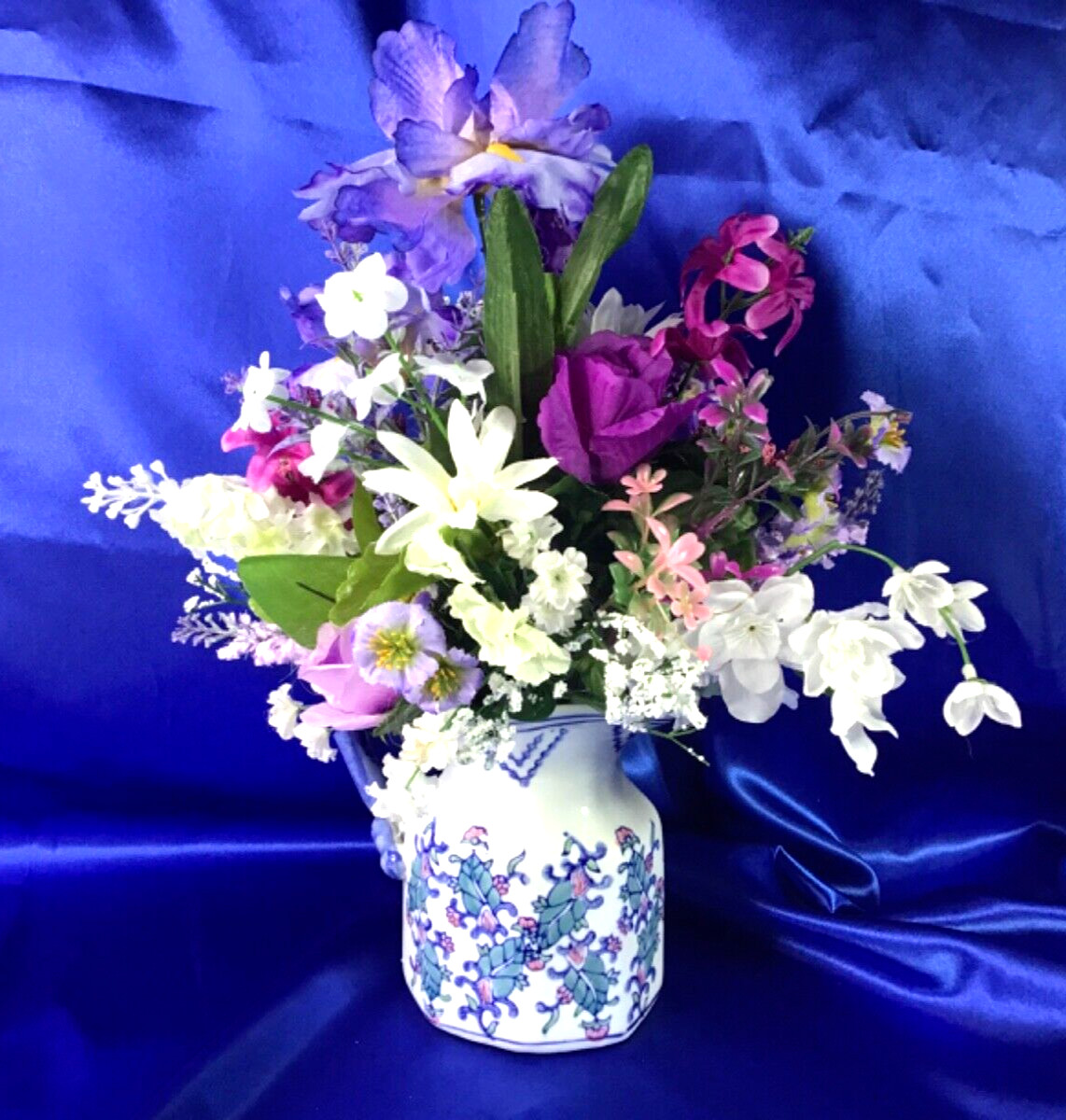 Beautiful Leaf Design Ceramic Pitcher with a Multicolor Floral Arrangement