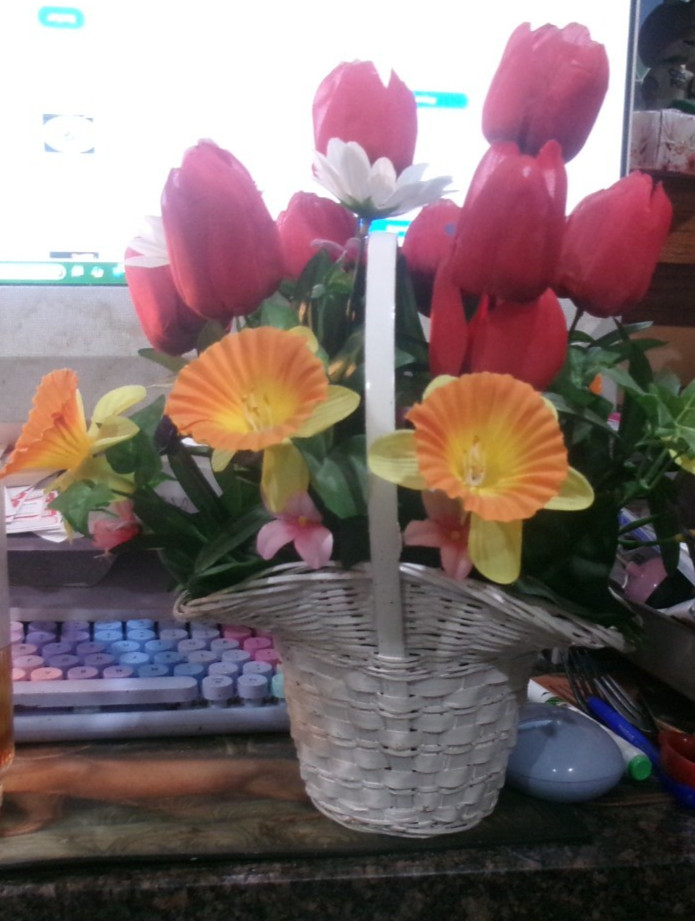 WHITE BASKET FULL OF ARTIFICIAL FLOWERS DARK PINK TULIPS AND YELLOW DAFFODILS AN