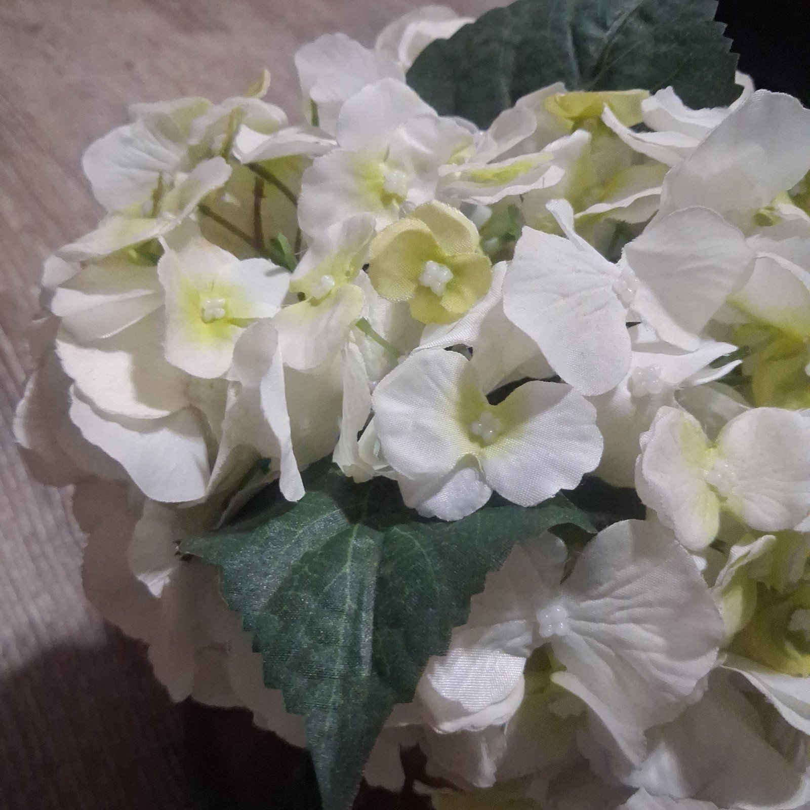 lifelike cream-white artificial silk hydrangea floral arrangement.