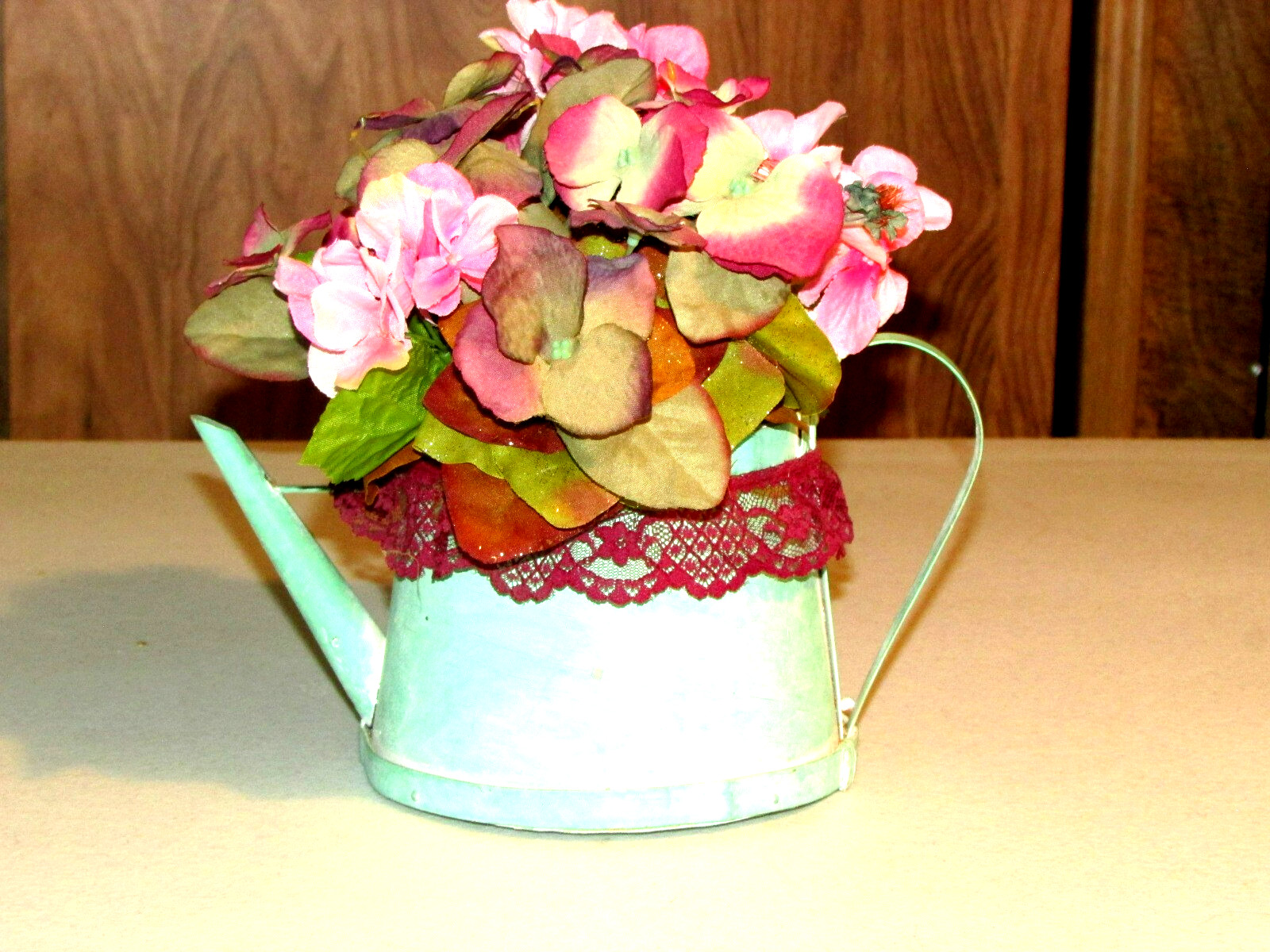 green cardboard WATER PAIL w/artificial FLOWERS 9x6x10″ overall (bdrm)