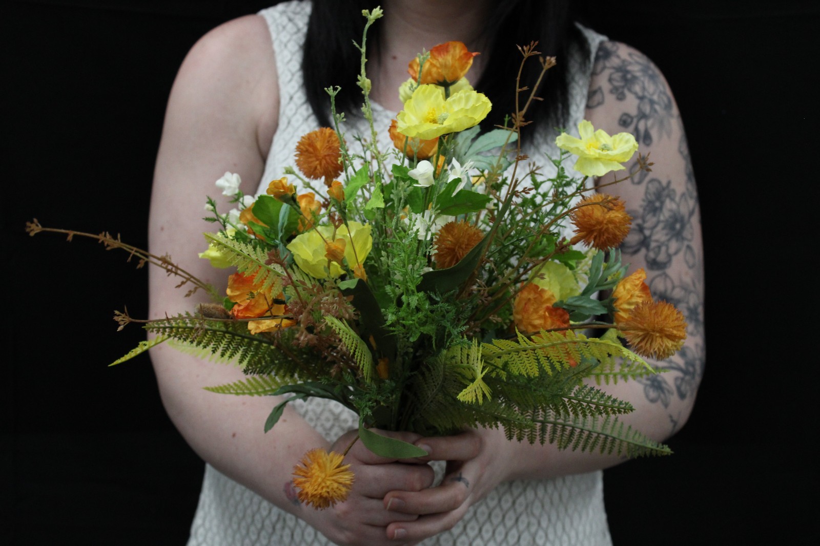 Yellow and orange poppy floral bouquet and matching boutonierrie