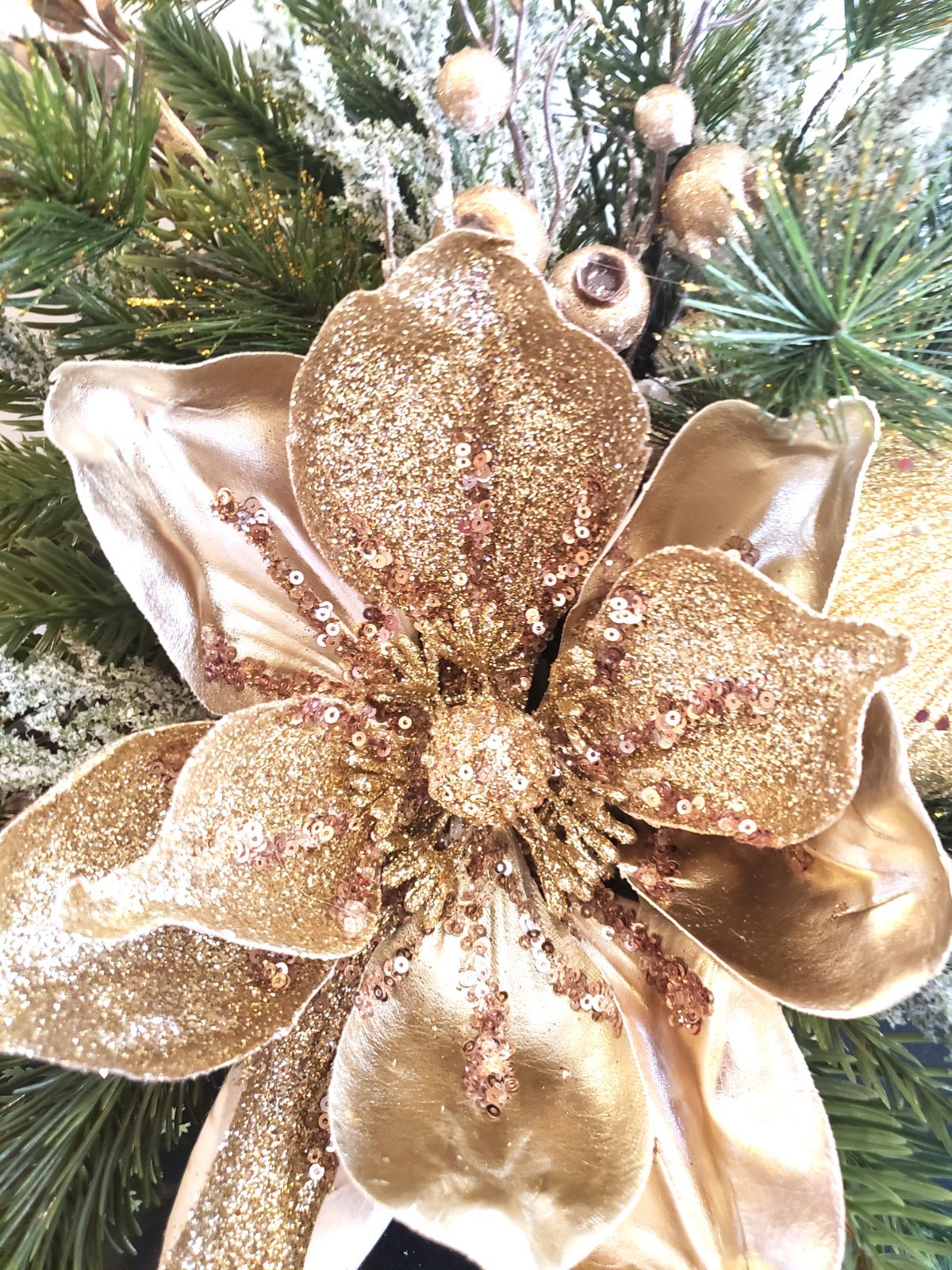 Gold magnolia Christmas floral arrangement, holiday floral arrangement