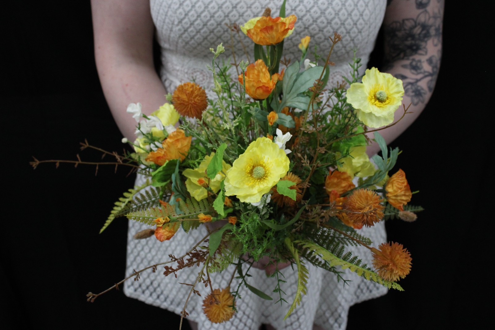 Yellow and orange poppy floral bouquet and matching boutonierrie