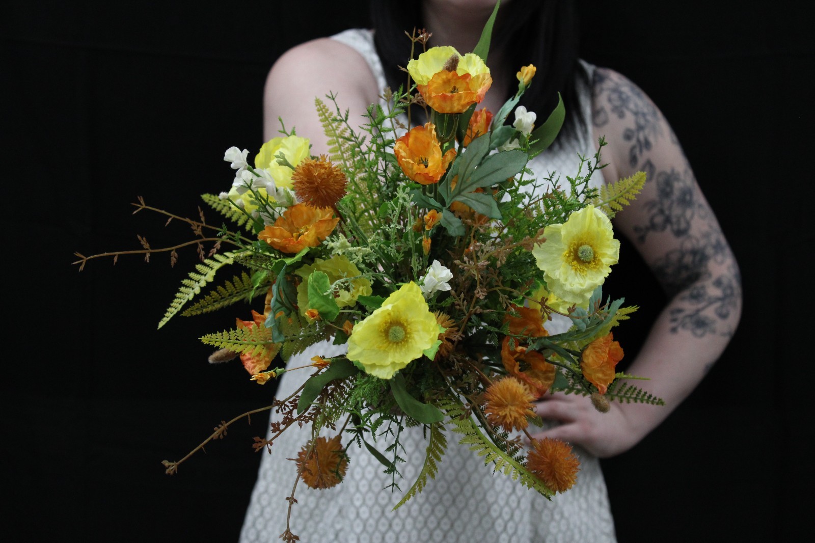 Yellow and orange poppy floral bouquet and matching boutonierrie