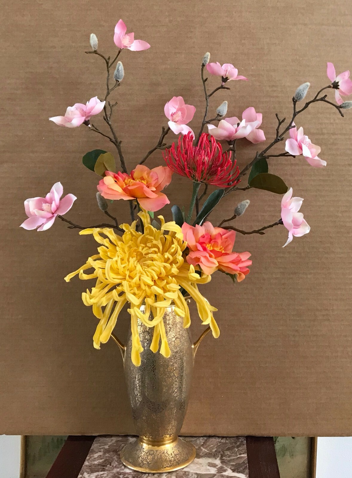 Floral Arrangement with Multi-Colored Silk Flowers in a Gold Colored Floral Vase