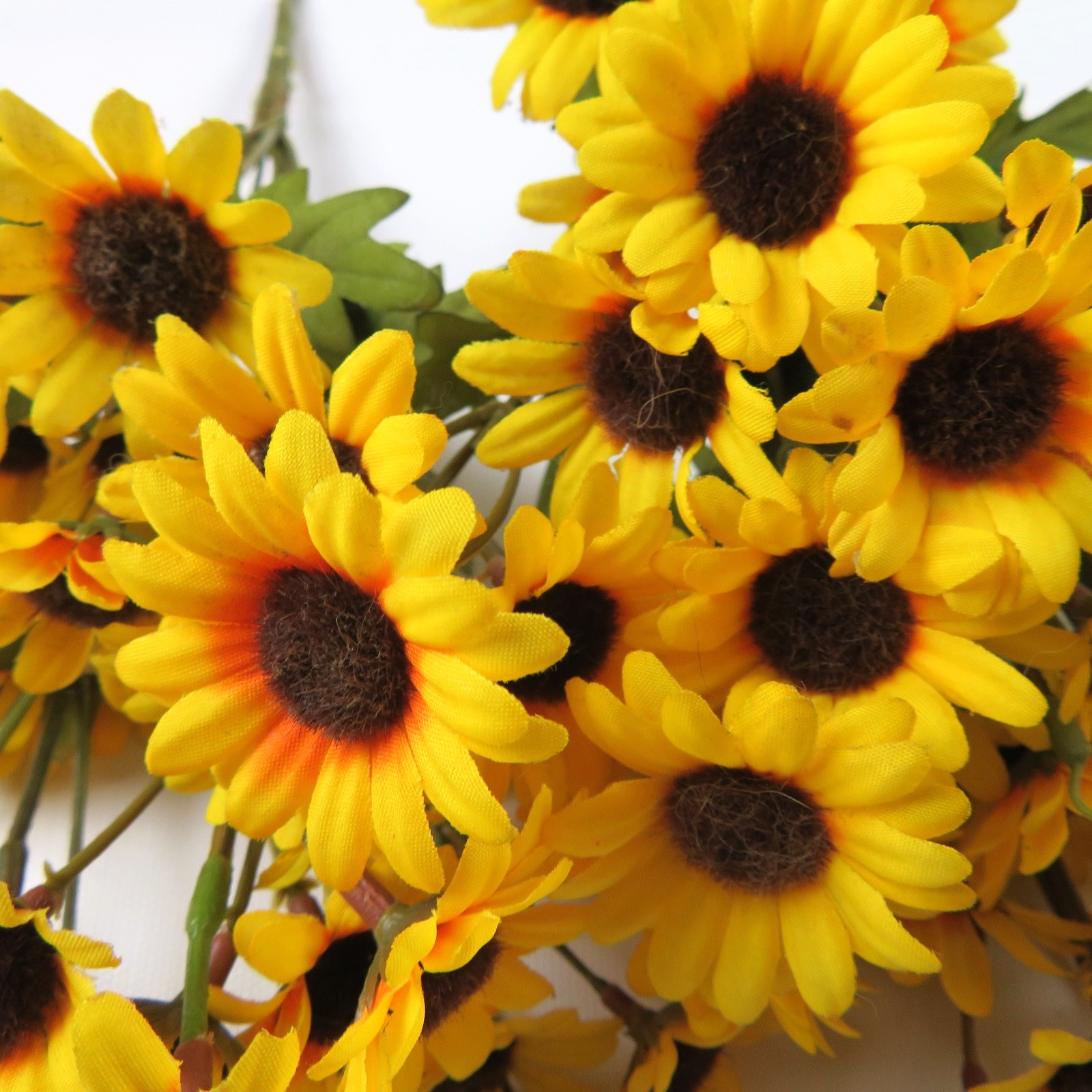 Mixed bouquet of artificial flowers, yellow & orange daisies, blue, 7 bundles