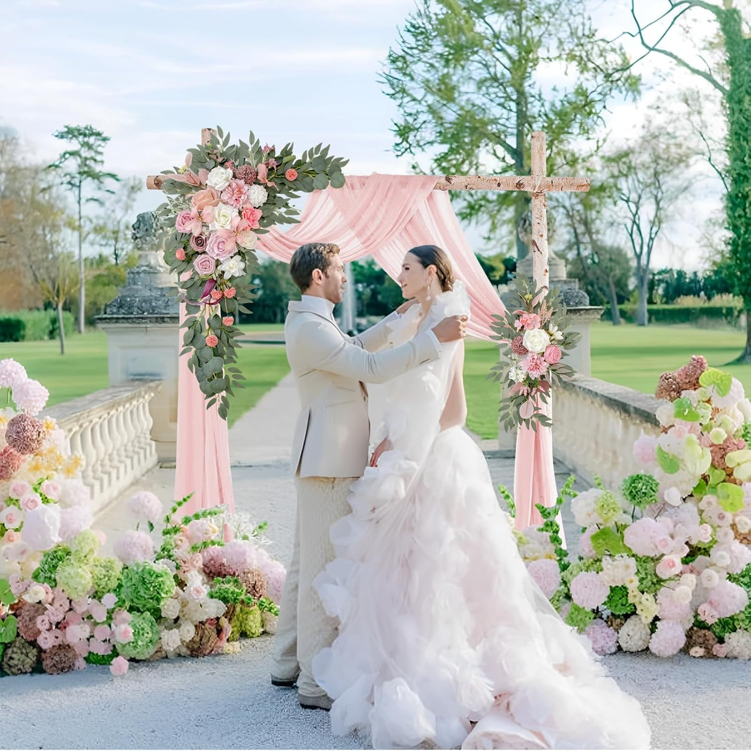 Elegant Wedding Arch with Pink Chiffon, Roses & Eucalyptus Decor
