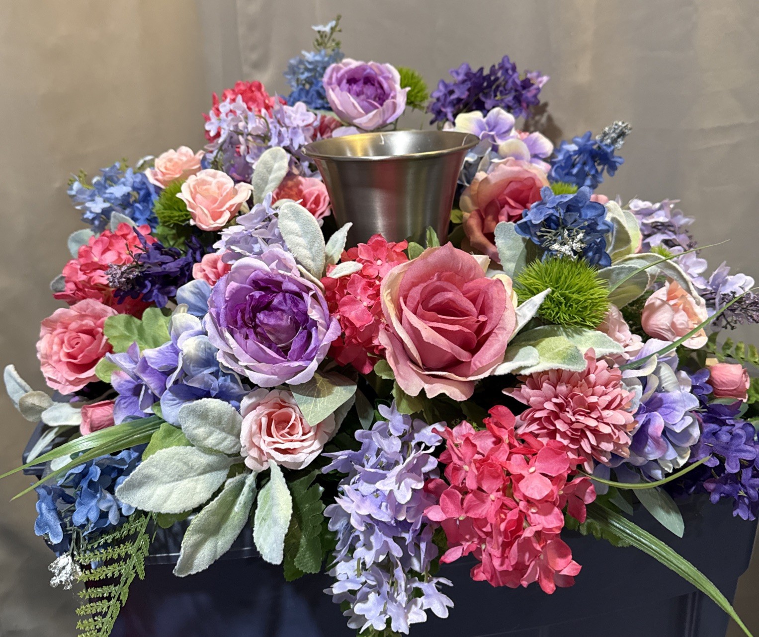 Floral Urn Ring Arrangement For Memorial Service 24” Round flowers Pinks, Blues