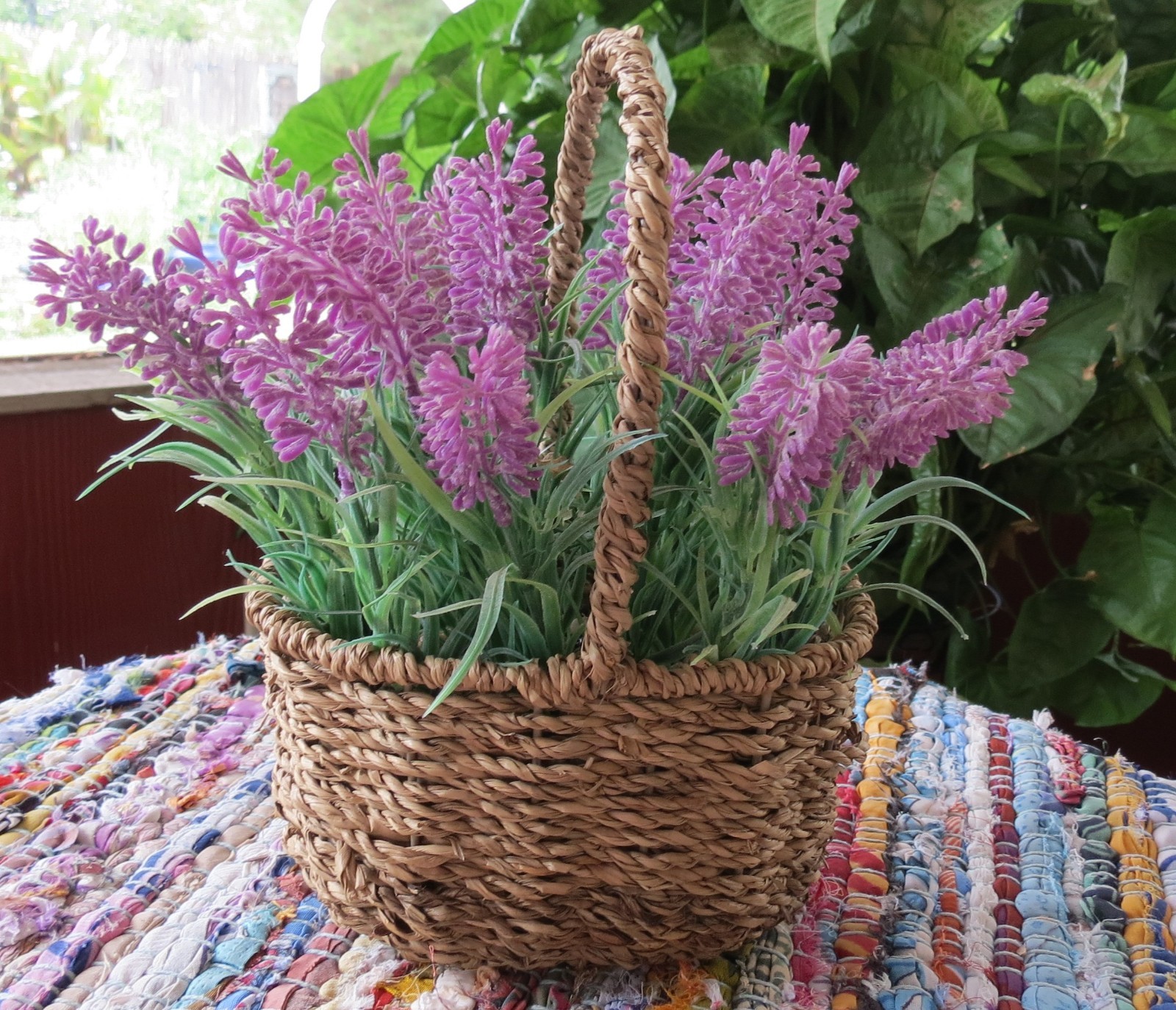 Lavender faux flowers in basket 18 ” around 4″ high 7″ wide