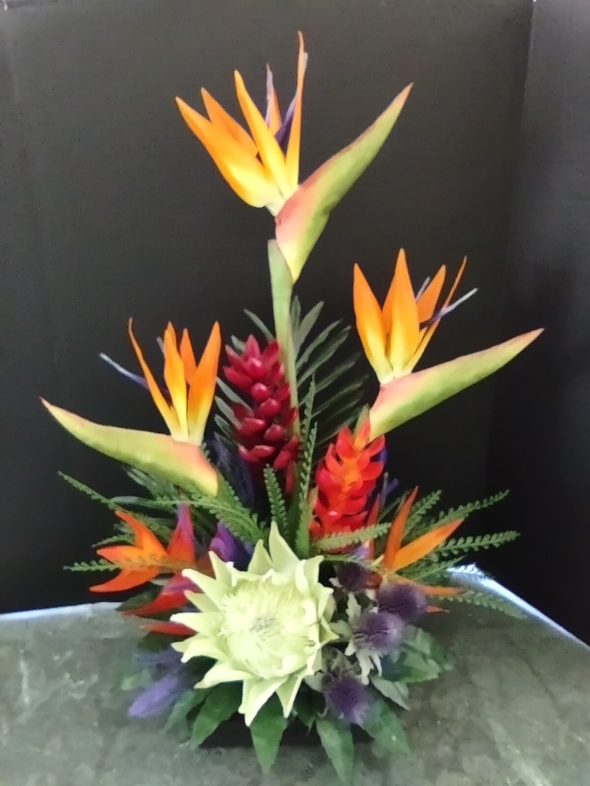 Artificia ltropical floral arrangement