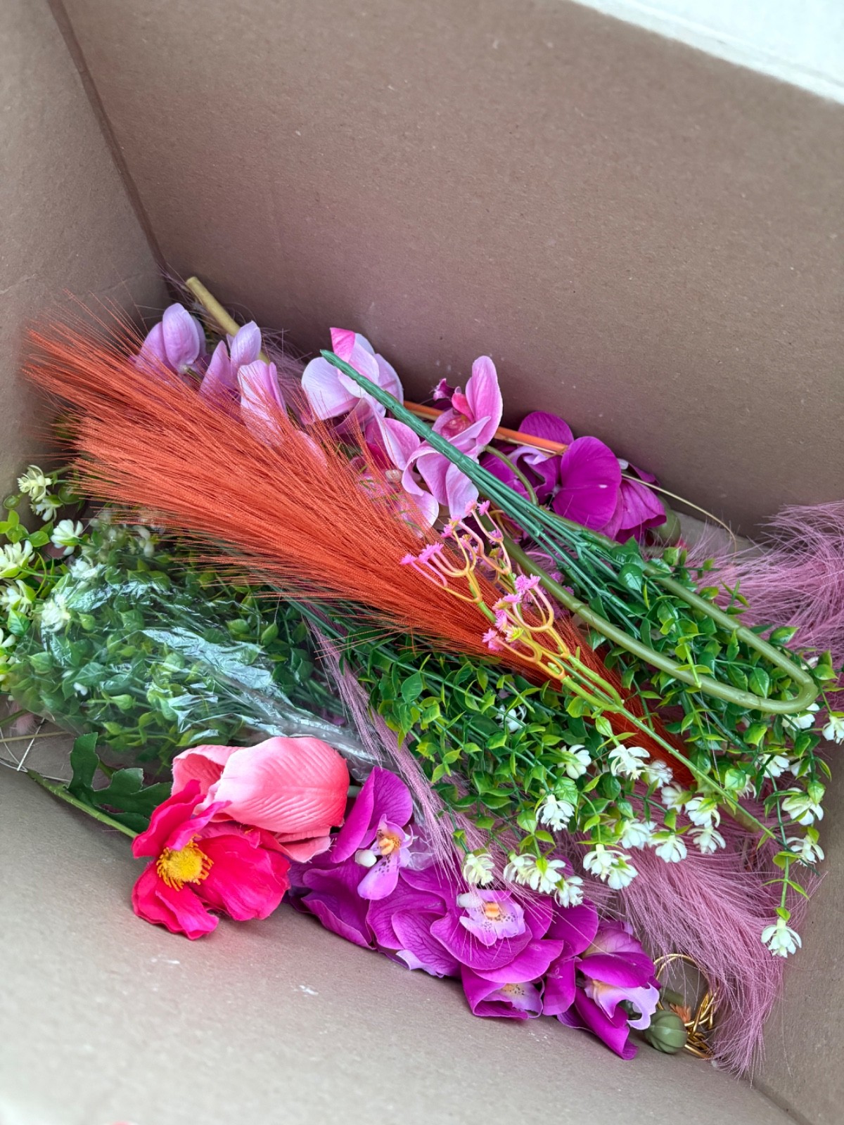 Lot of new pink and orange faux flowers and greenery, small box full of floral