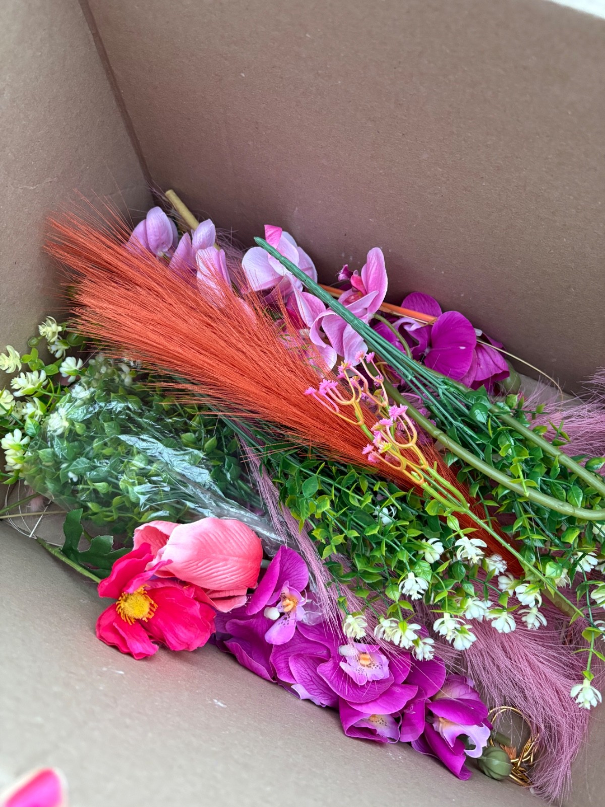 Lot of new pink and orange faux flowers and greenery, small box full of floral