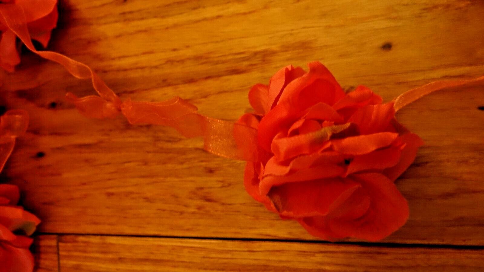 Pink Silk Rose Floral Garland Attached To Pink Organza Ribbon