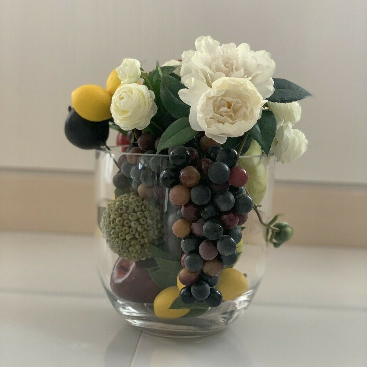 Pomegranate, Lemon, Grapes with Flower Centerpiece Arrangement with Clear Vase 