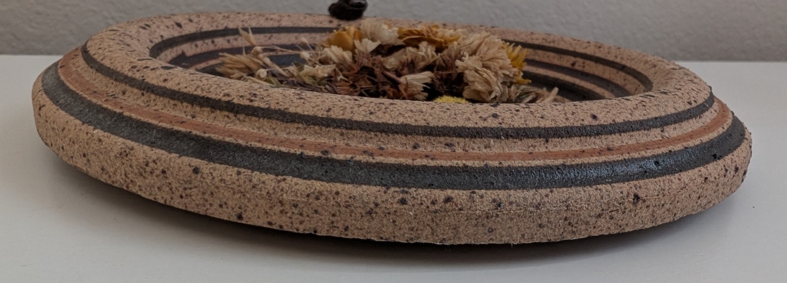 Dried flowers wall hanging round pottery circle speckled floral art boho fall