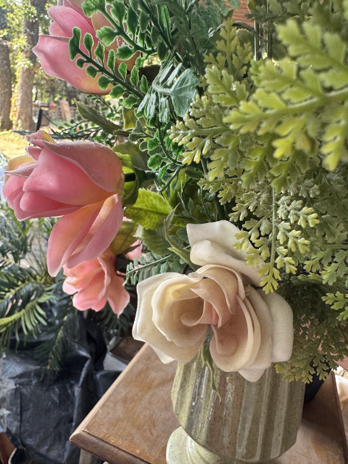 Faux Rose Flower Arrangement In Pottery Vase
