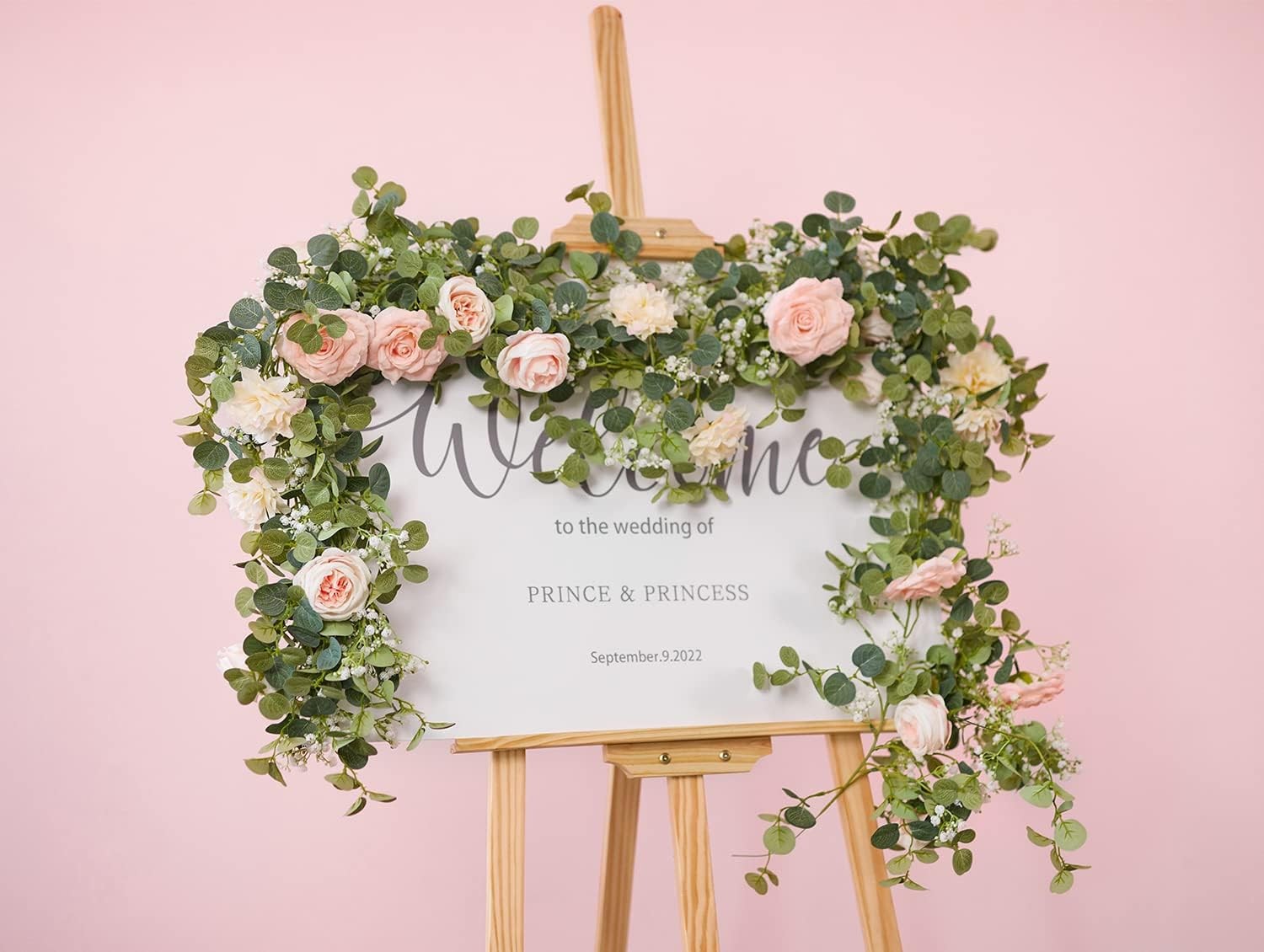 Artificial eucalyptus wreath with flowers, fake roses, and baby’s breath flowers