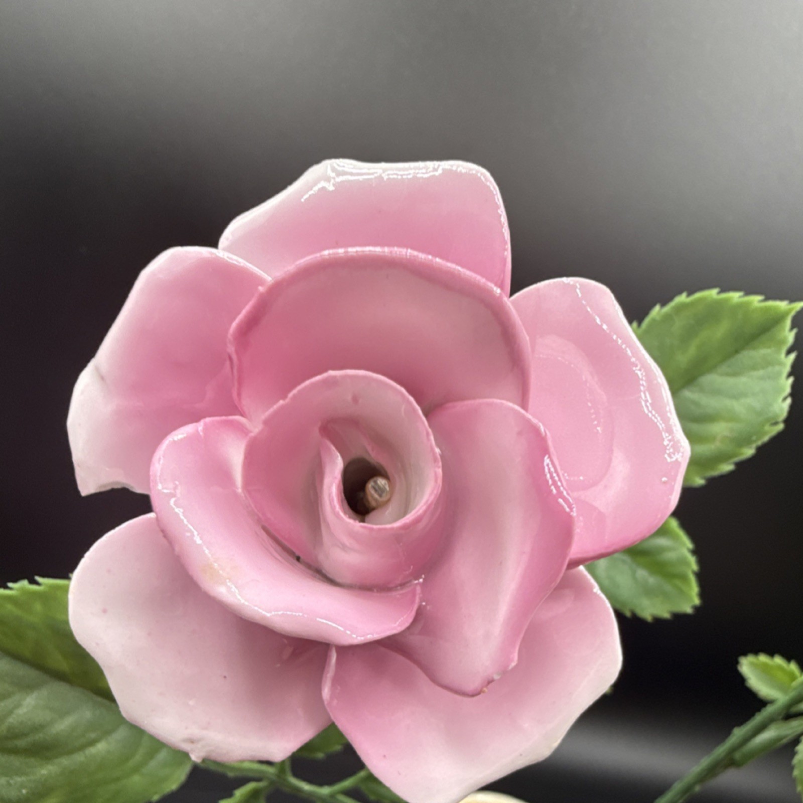 Porcelain flowers, pink roses with plastic stems and leaves