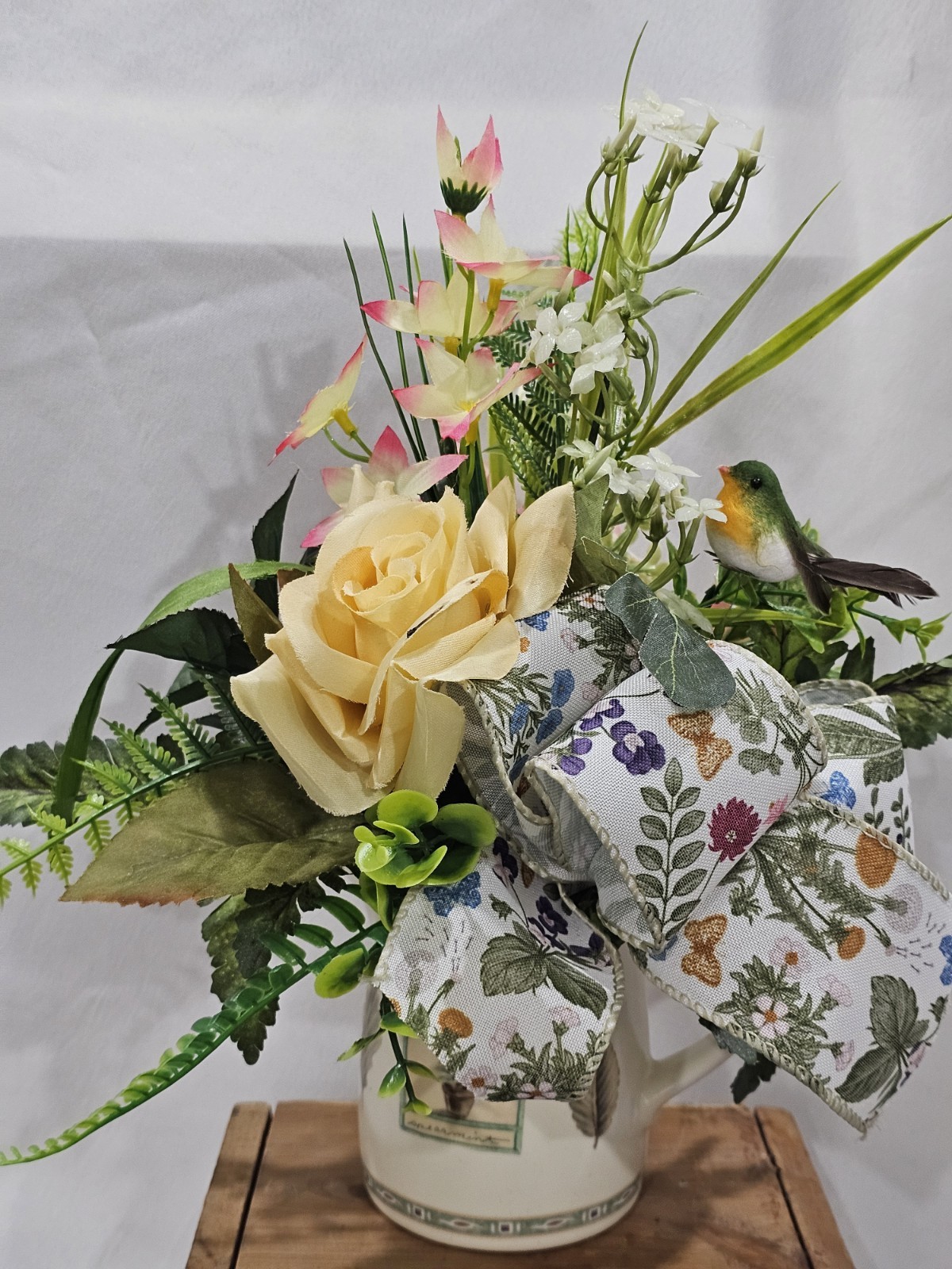 Artificial Flower Arrangement Soft Yellow Roses in a Homey Green & White vase
