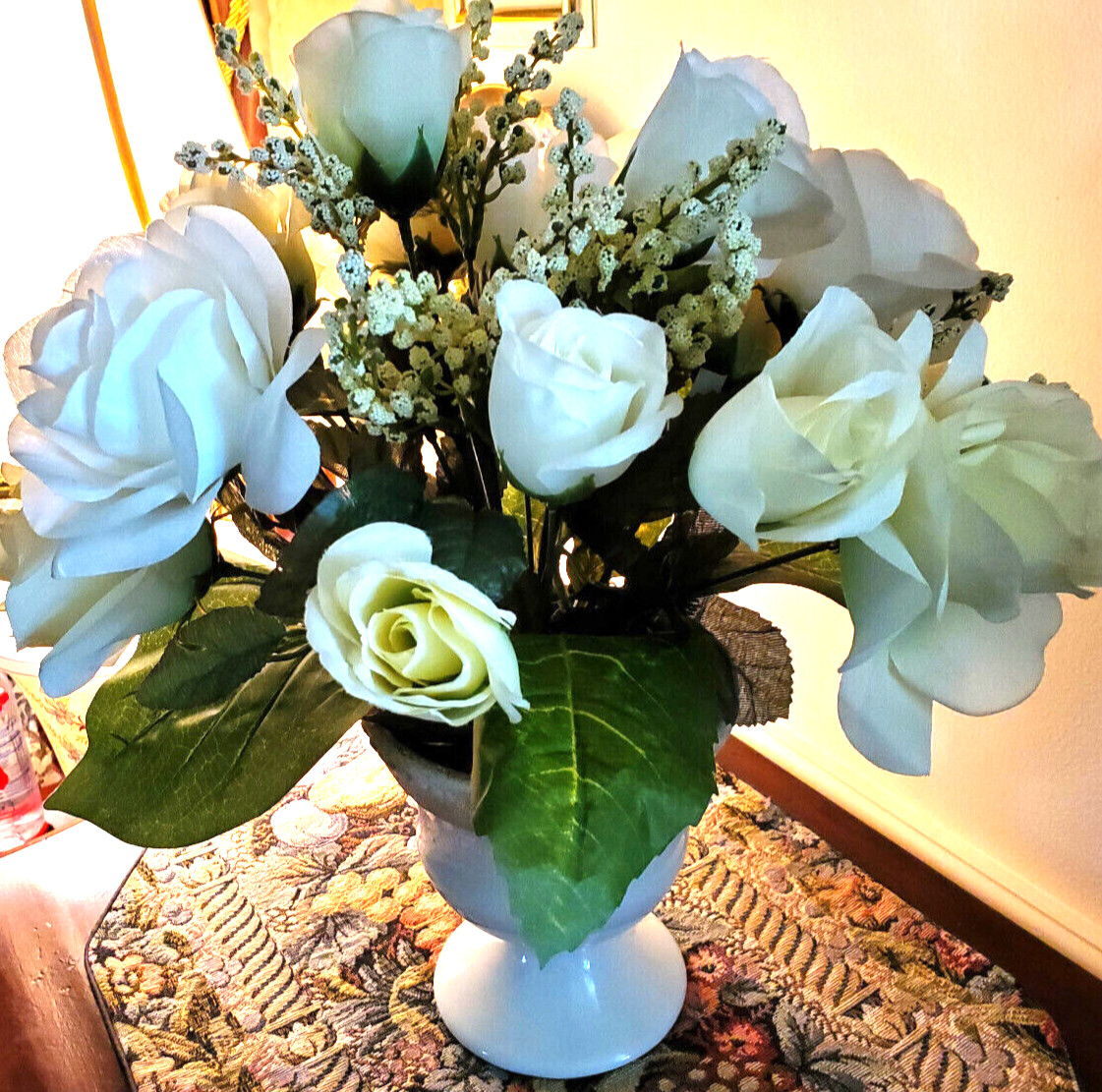 White and pale-yellow silk roses arrangement centerpiece in white vase