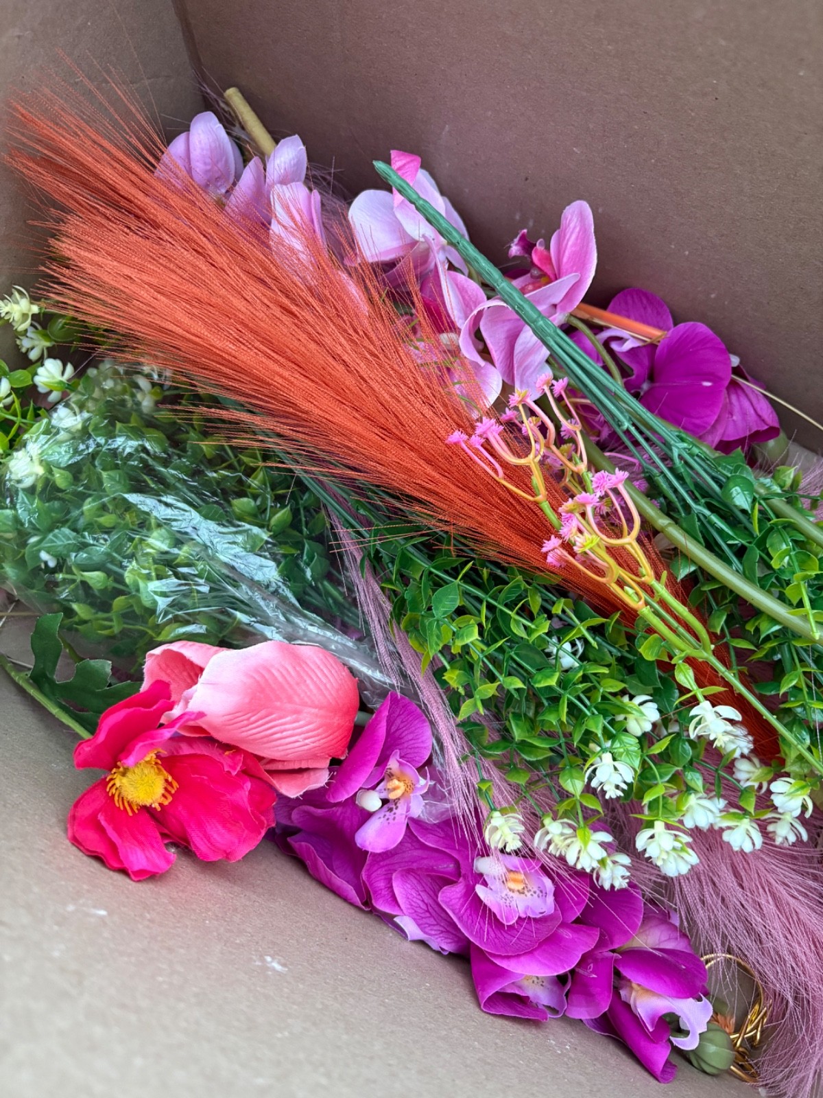 Lot of new pink and orange faux flowers and greenery, small box full of floral