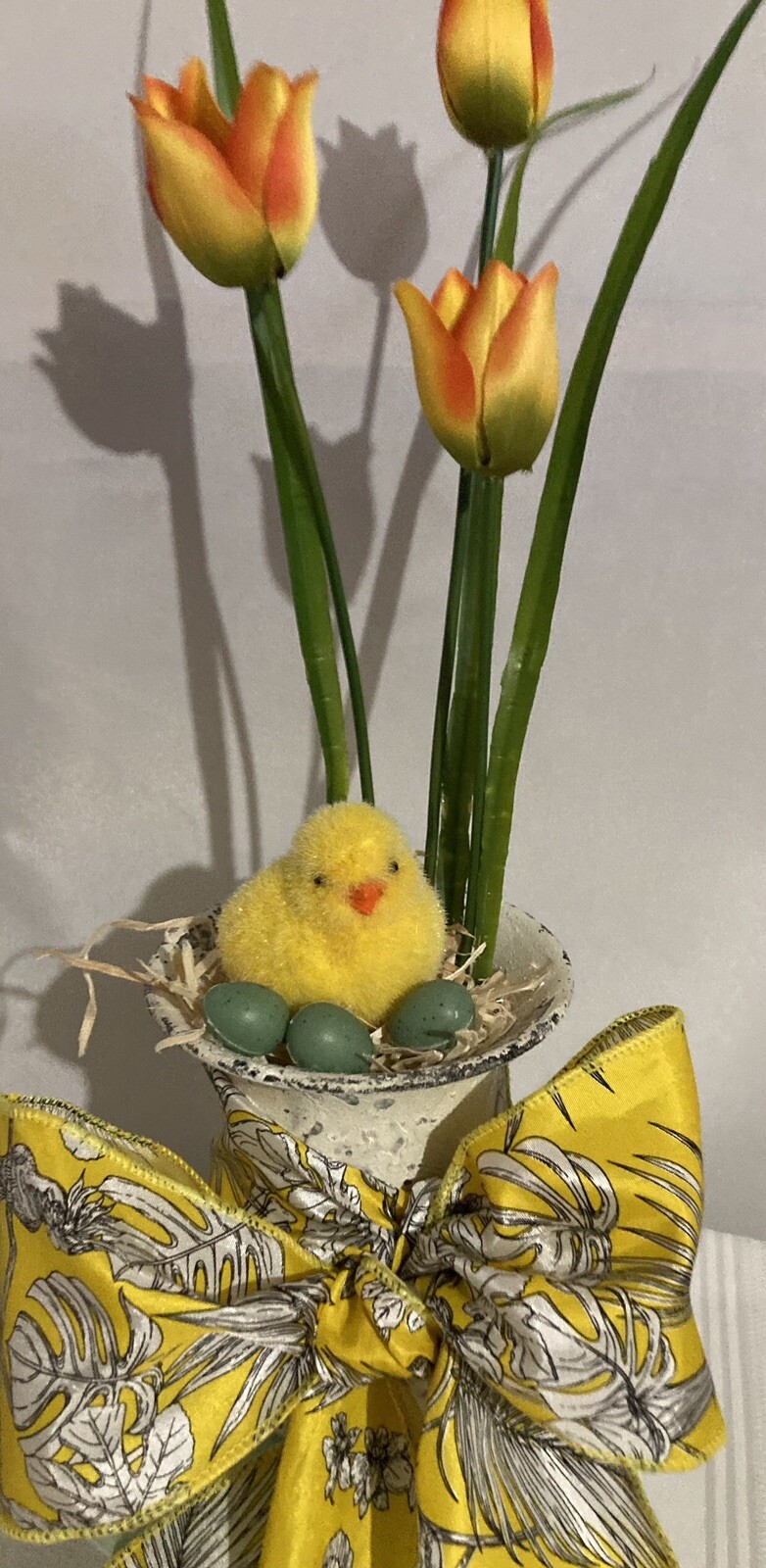 Cute Little Yellow Chick With Eggs In An Urn