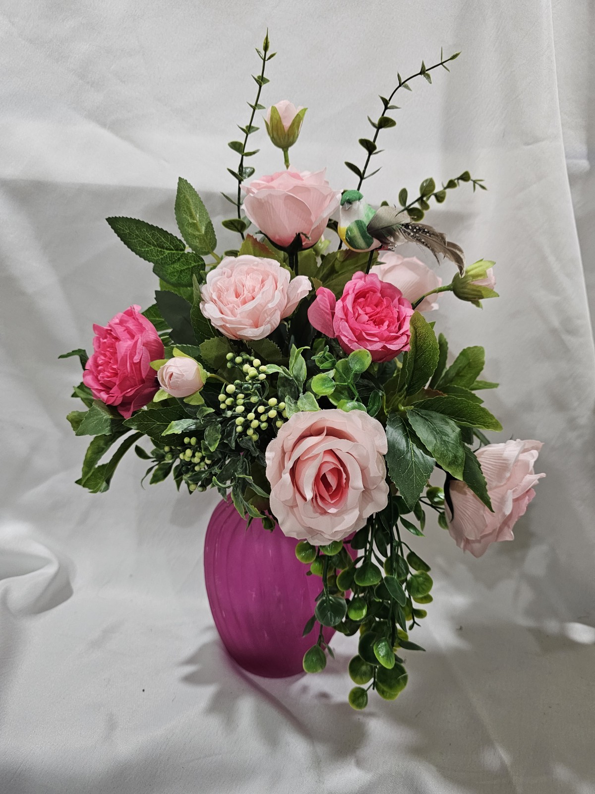 Varied Colors of soft Pink Artificial Roses in a beautiful pink vase