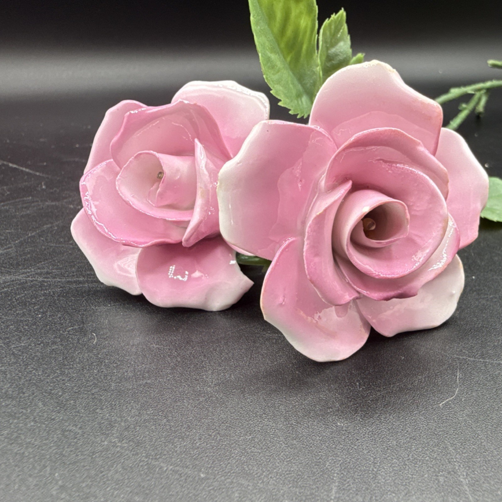 Porcelain flowers, pink roses with plastic stems and leaves