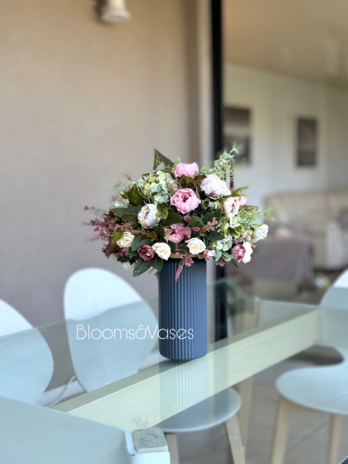 Blue and white flower arrangement in a vase , width 12’, height 15’, home decor.