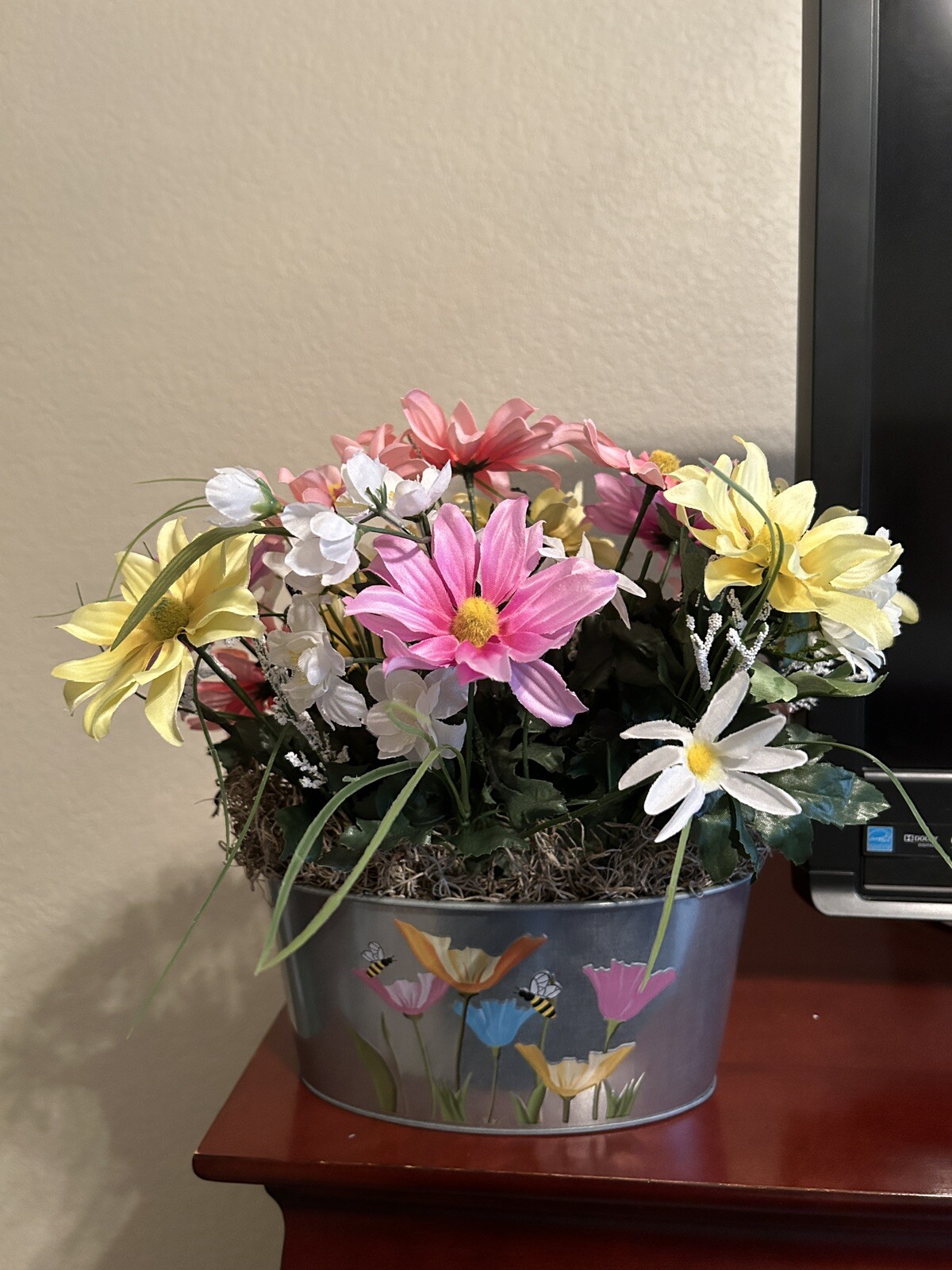Spring Flower Arrangement in a Silver Metal Canister with Flower and Bee Motif