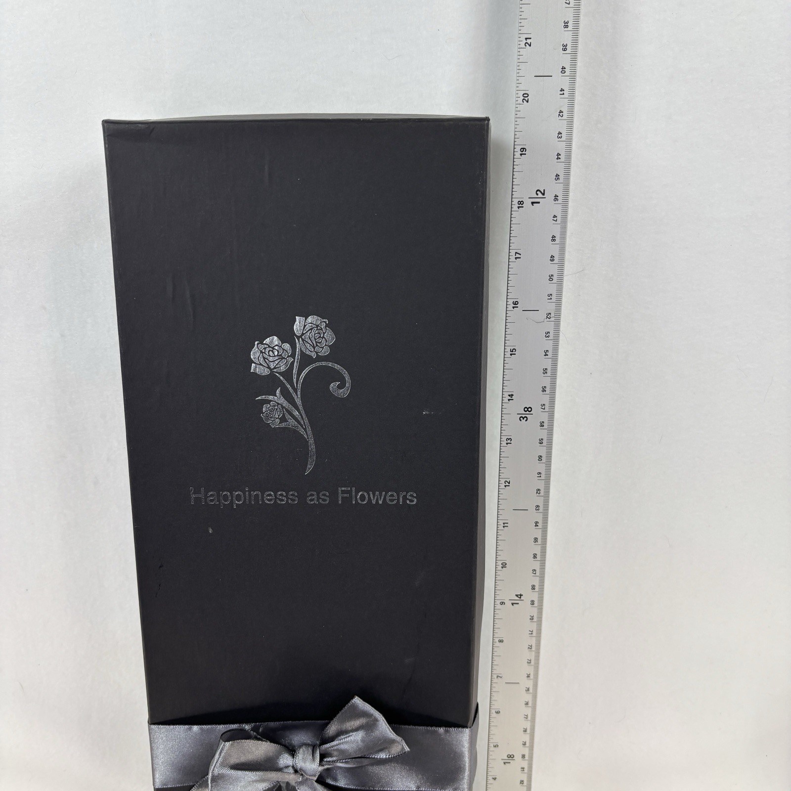 Gold-plated artificial rose bouquet in a black gift box