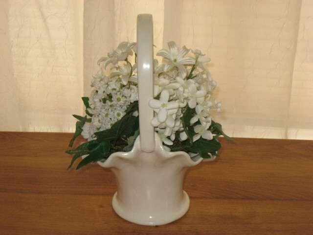WHITE & GREEN FLOWERS IN A WHITE PORCELAIN BASKET