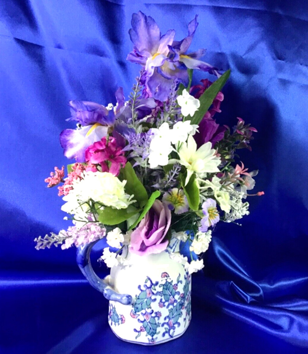 Beautiful Leaf Design Ceramic Pitcher with a Multicolor Floral Arrangement