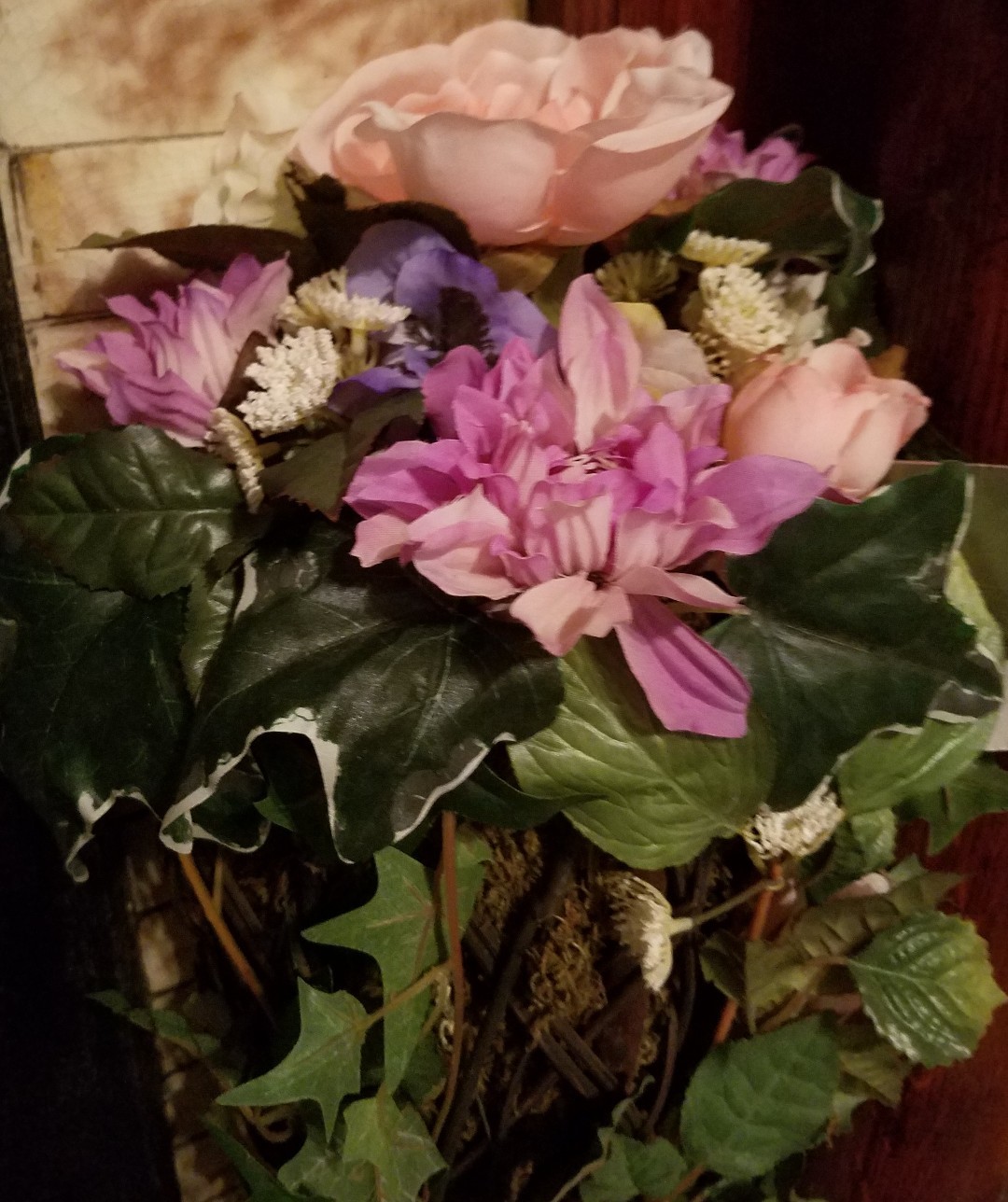 Faux Flower Arrangement In Vine And Moss
