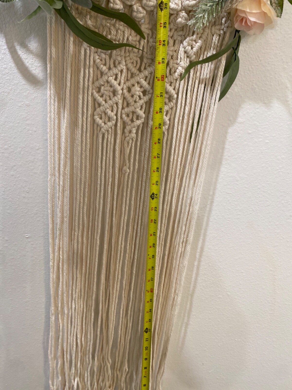 Macramé Boho pastel colored flowered wreath. Measures 58 inches in length
