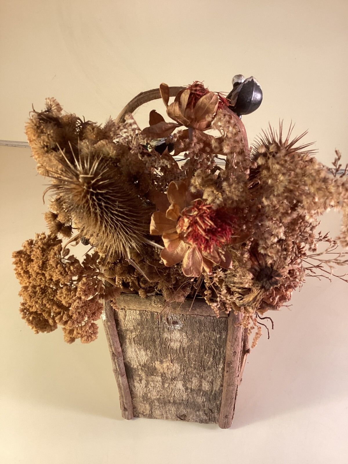 Wood birdhouse centerpiece with dried flowers, turkeys, twigs, windows, chimney