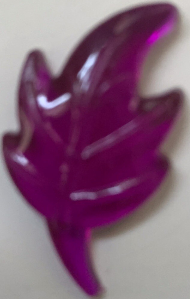 Bag of plastic leaves to scatter for Autumn decoration. Green,red,gold & violet 